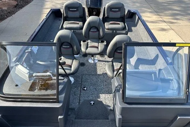 Slide: The Image of 2025 Tracker Pro Guide V-175 Combo boat interior with seating and windshield. - 8