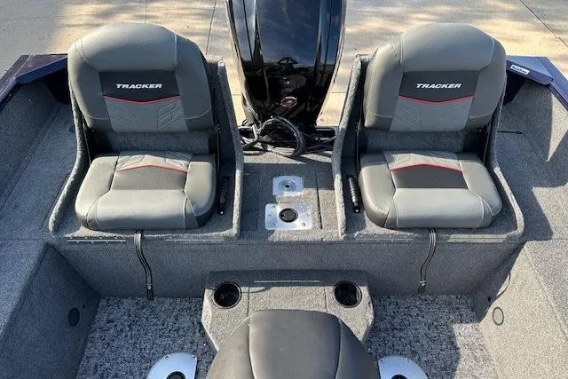Slide: The Image of 2025 Tracker Pro Guide V-175 Combo boat interior with dual seats and motor. - 9