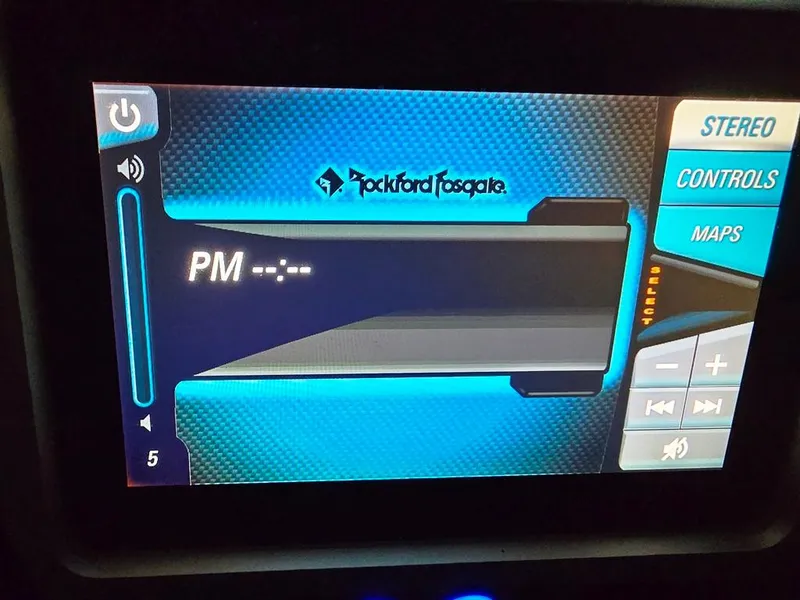 Slide: The Image of Touchscreen display of a 2015 Malibu Wakesetter 22 VLX Surf Gate boat, featuring Rockford Fosgate controls. - 17