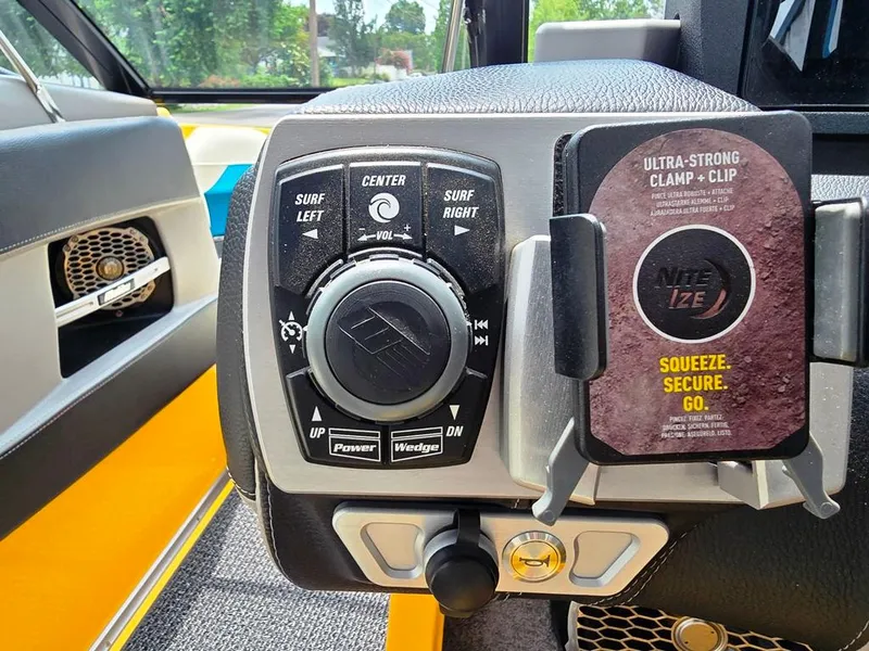 Slide: The Image of Control panel of 2015 Malibu Wakesetter 22 VLX Surf Gate with Nite Ize phone holder. - 20