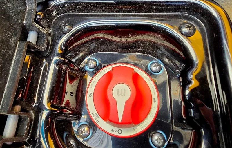 Slide: The Image of Close-up of a red control dial in a 2015 Malibu Wakesetter 22 VLX Surf Gate. - 24