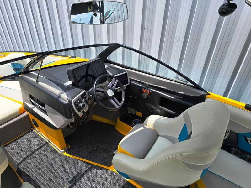 Slide: The Image of 2015 Malibu Wakesetter 22 VLX Surf Gate interior with modern dashboard and steering wheel. - 27