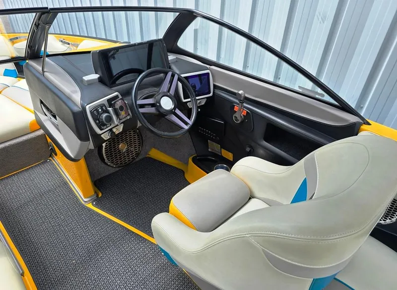 Slide: The Image of 2015 Malibu Wakesetter 22 VLX Surf Gate interior with modern dashboard and steering wheel. - 3