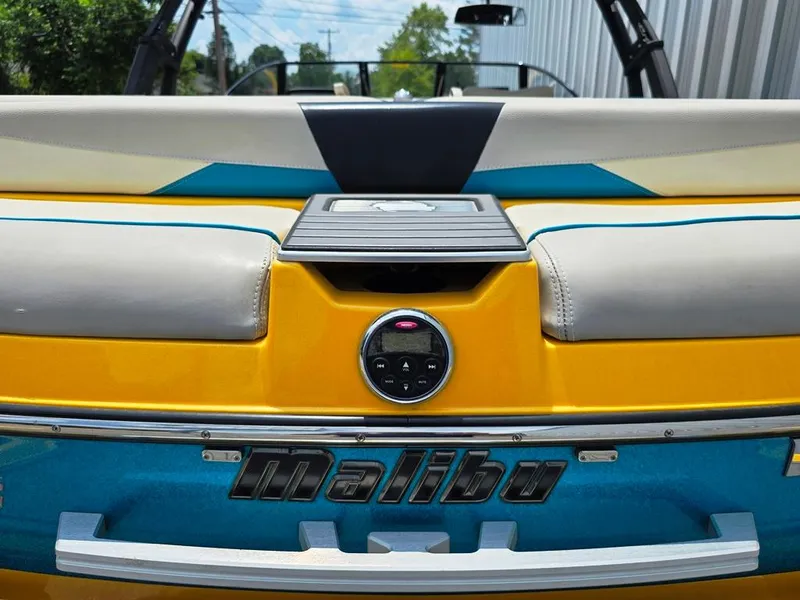 Slide: The Image of 2015 Malibu Wakesetter 22 VLX Surf Gate, yellow and blue boat interior detail. - 9