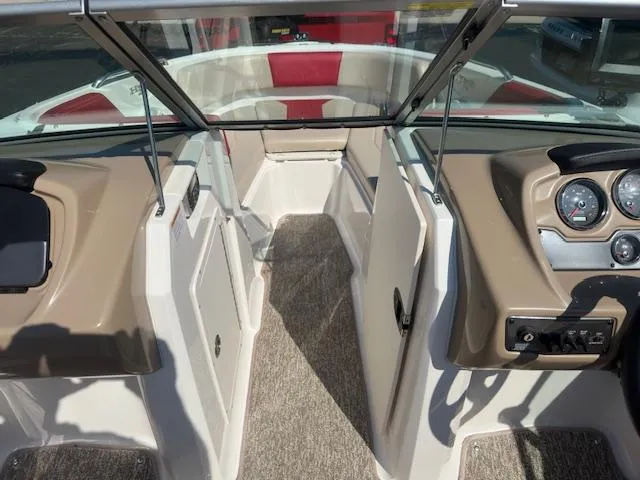 Slide: The Image of 2018 Chaparral 21 H2O Ski & Fish boat interior with beige and red seating. - 12