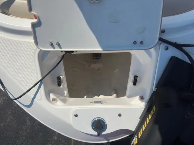 Slide: The Image of Open storage compartment on a 2018 Chaparral 21 H2O Ski & Fish boat. - 19