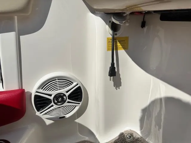 Slide: The Image of 2018 Chaparral 21 H2O Ski & Fish boat interior with speaker and power outlet. - 22
