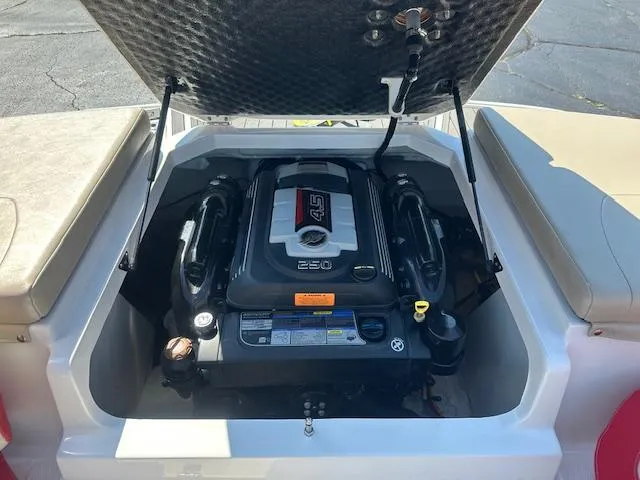 Slide: The Image of 2018 Chaparral 21 H2O Ski & Fish boat engine compartment with open hatch. - 28