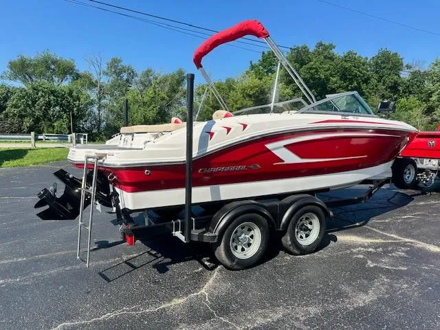 Slide: The Image of 2018 Chaparral 21 H2O Ski & Fish boat on trailer, red and white design. - 3