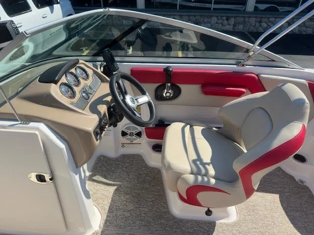 Slide: The Image of 2018 Chaparral 21 H2O Ski & Fish boat interior with steering wheel and seating. - 8