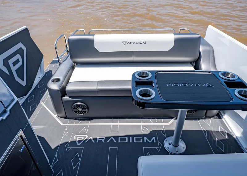 Slide: The Image of 2025 Paradigm Damascus 266 Surf boat interior with seating and table, featuring modern design. - 10