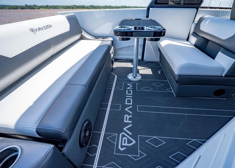 Slide: The Image of Luxurious interior of 2025 Paradigm Damascus 266 Surf boat with stylish seating and table. - 12