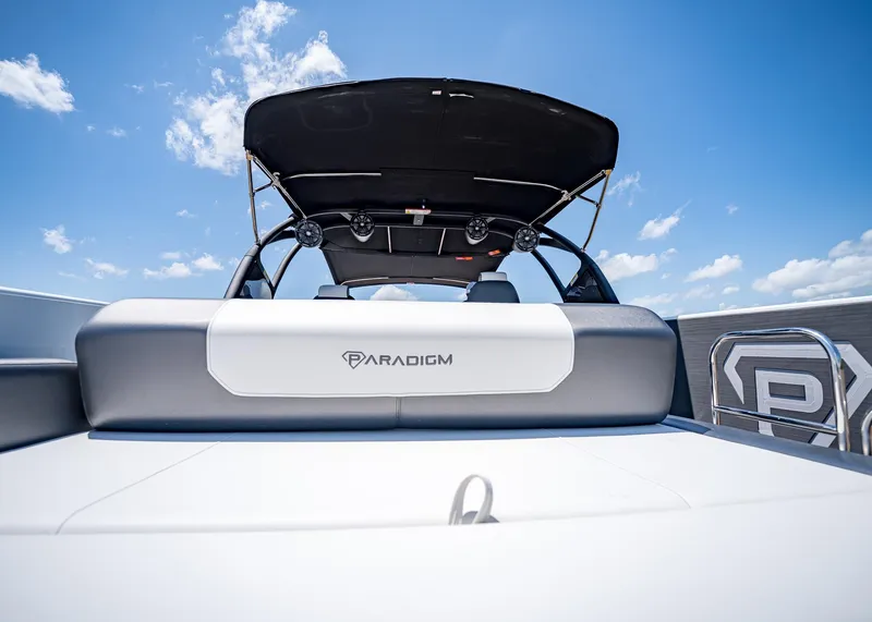 Slide: The Image of 2025 Paradigm Damascus 266 Surf boat with sleek design under clear blue sky. - 18