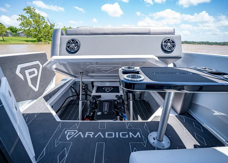 Slide: The Image of 2025 Paradigm Damascus 266 Surf boat interior with open engine compartment and sleek design. - 23