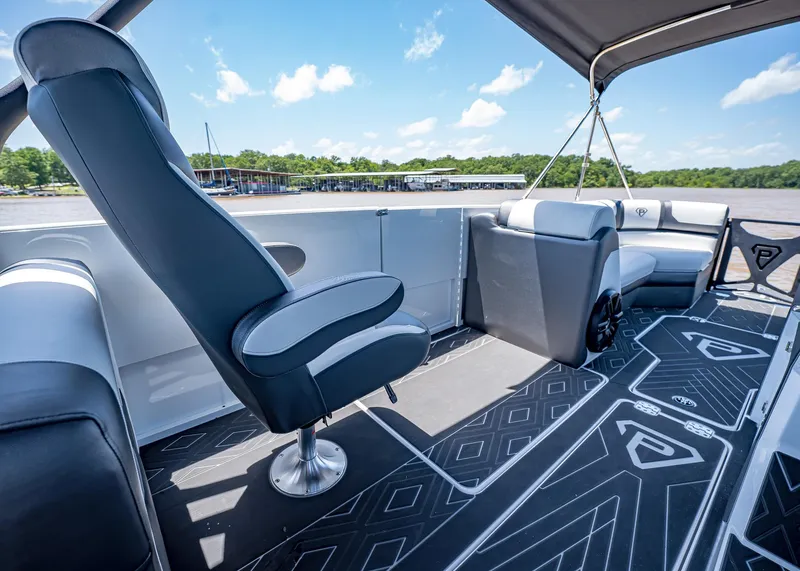 Slide: The Image of 2025 Paradigm Damascus 266 Surf boat interior with modern seating and stylish flooring. - 25