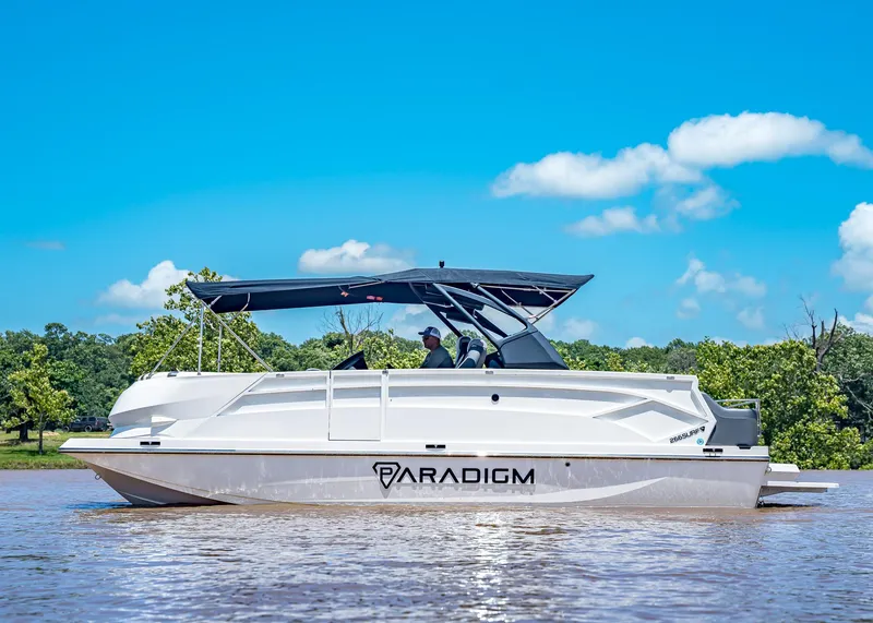 Slide: The Image of 2025 Paradigm Damascus 266 Surf boat on a sunny lake with blue skies. - 3