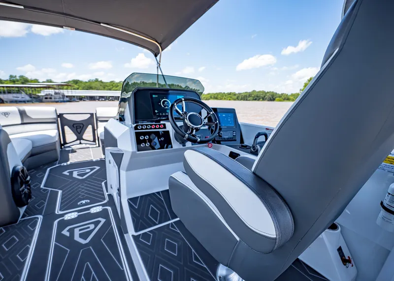 Slide: The Image of 2025 Paradigm Damascus 266 Surf boat interior with modern helm and seating. - 30