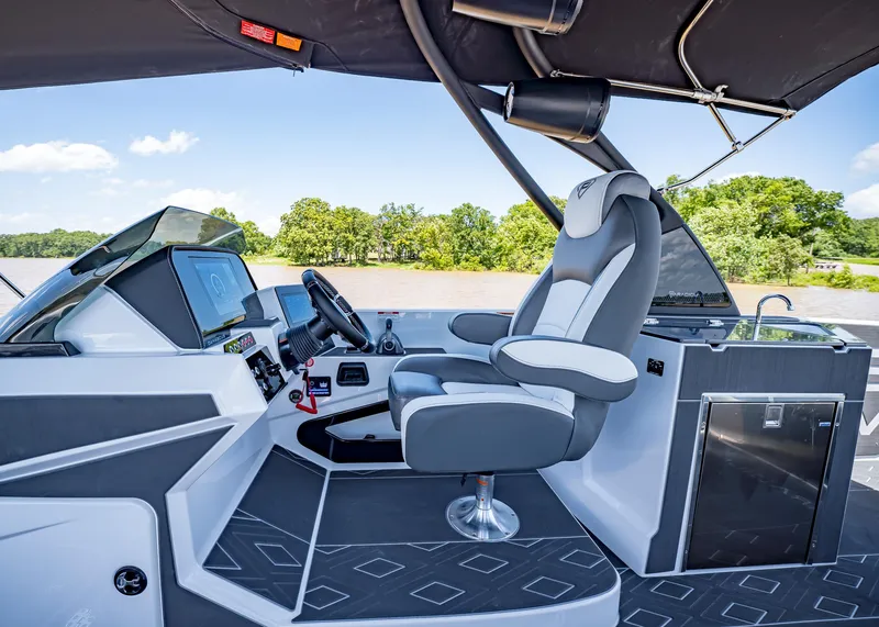 Slide: The Image of 2025 Paradigm Damascus 266 Surf boat cockpit with modern controls and luxurious seating. - 32