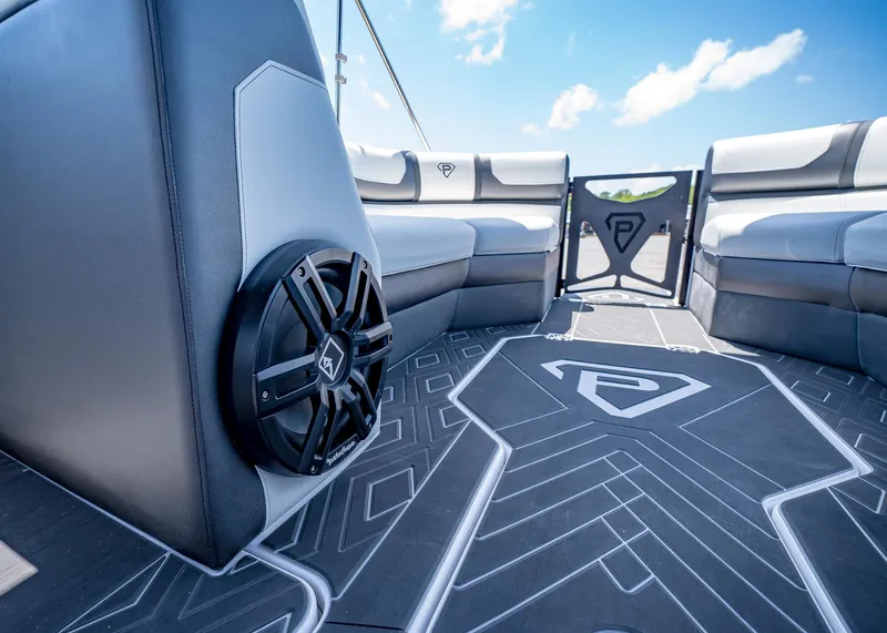 Slide: The Image of 2025 Paradigm Damascus 266 Surf boat interior with sleek seating and modern speaker system. - 36