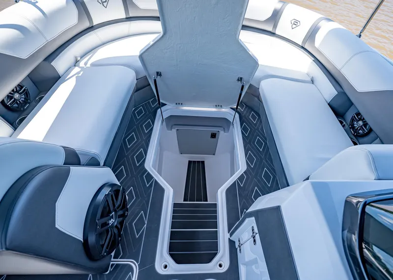 Slide: The Image of 2025 Paradigm Damascus 266 Surf boat interior with seating and storage compartment. - 37