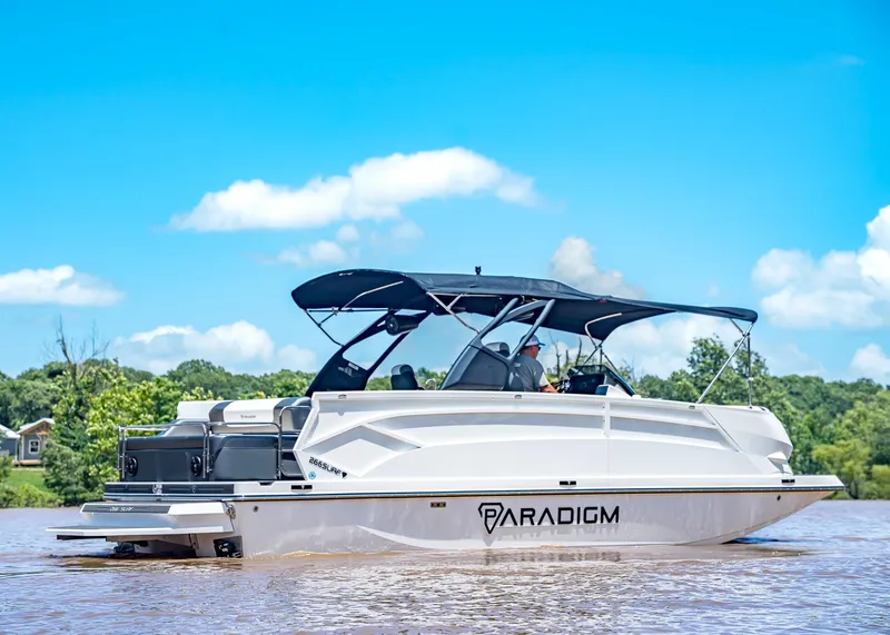 Slide: The Image of 2025 Paradigm Damascus 266 Surf boat on a sunny day, cruising on a lake. - 7