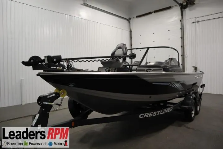The Image of 2024 Crestliner 1950 Fish Hawk WT boat in showroom, featuring sleek design and advanced fishing equipment. - 1