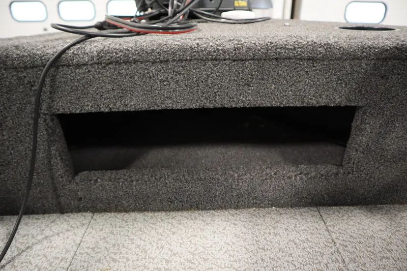 Slide: The Image of 2024 Crestliner 1950 Fish Hawk WT interior storage compartment with wiring visible. - 17