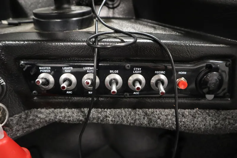 Slide: The Image of Control panel of 2024 Crestliner 1950 Fish Hawk WT boat with switches and wiring. - 38