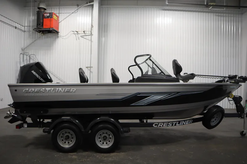 Slide: The Image of 2024 Crestliner 1950 Fish Hawk WT boat in a showroom, side view. - 4