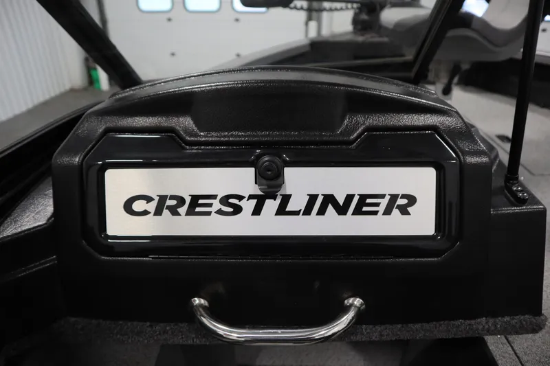 Slide: The Image of 2024 Crestliner 1950 Fish Hawk WT boat dashboard with logo in a showroom. - 44