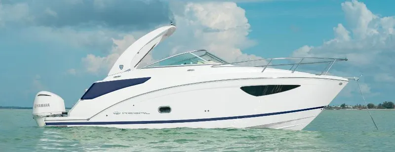 The Image of 2026 Regal 26 XO boat on calm water under a cloudy sky. - 0