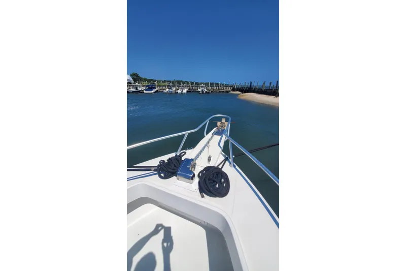 Slide: The Image of Bow view of 1998 Ocean Master 31 Center Console at marina. - 12