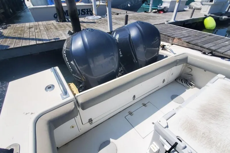 Slide: The Image of 1998 Ocean Master 31 Center Console with dual outboard engines at dock. - 14