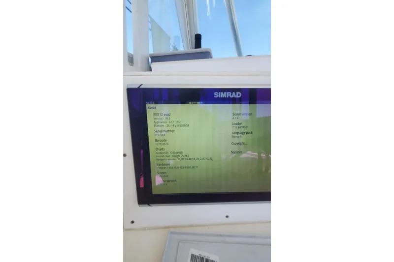 Slide: The Image of Simrad display on 1998 Ocean Master 31 Center Console showing system information. - 17