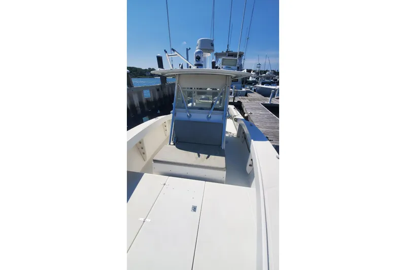 Slide: The Image of 1998 Ocean Master 31 Center Console boat docked at marina. - 20