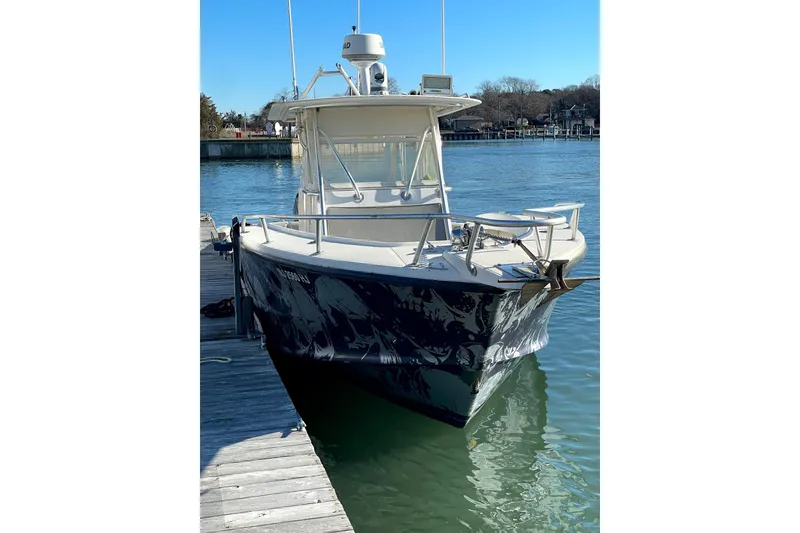 Slide: The Image of 1998 Ocean Master 31 Center Console boat docked on a sunny day. - 4