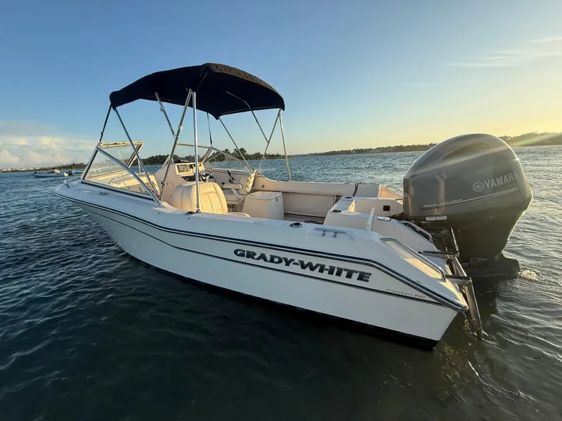 Slide: The Image of 2020 Grady-White Freedom 192 boat on water at sunset with Yamaha engine. - 11