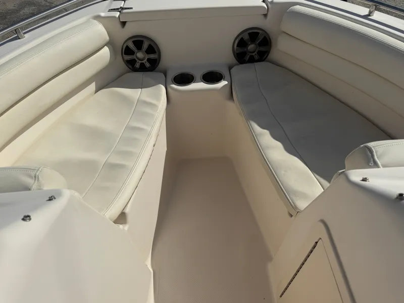 Slide: The Image of 2020 Grady-White Freedom 192 boat interior with white seating and cup holders. - 15
