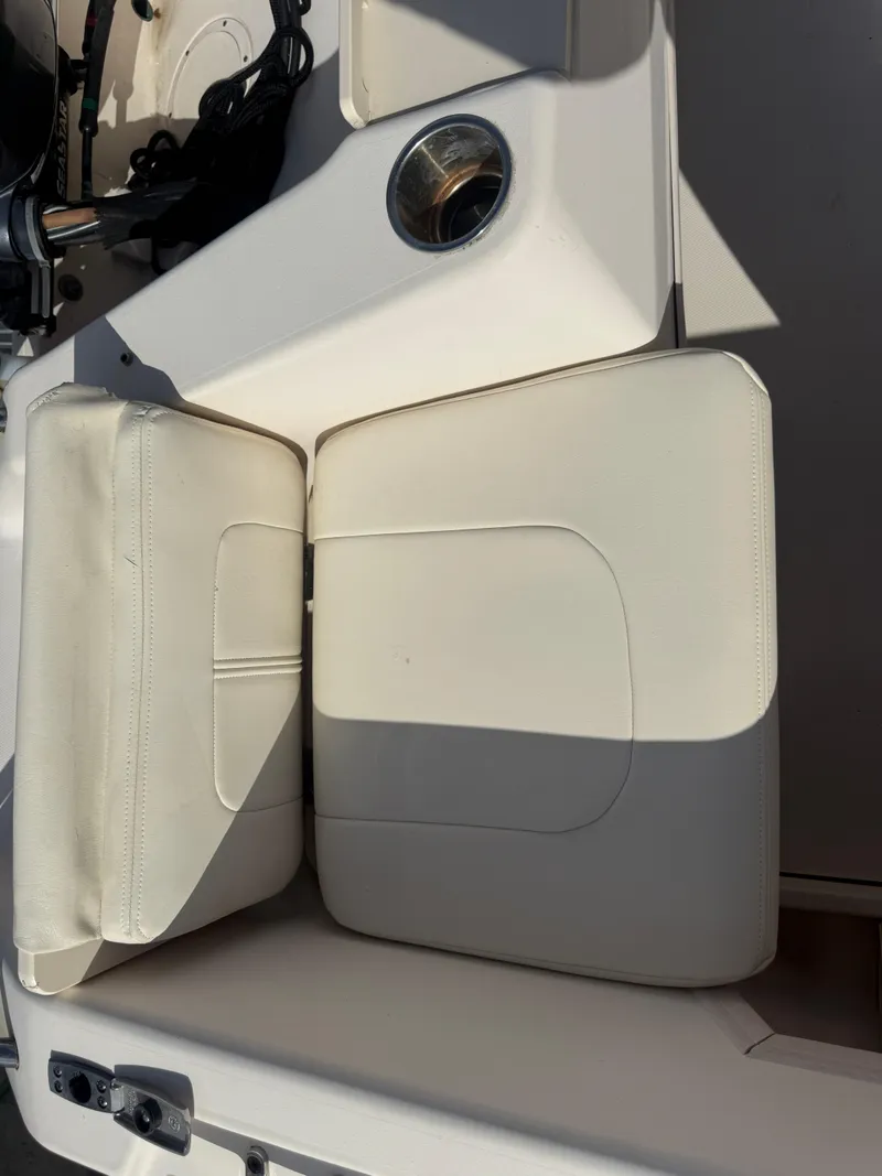 Slide: The Image of 2020 Grady-White Freedom 192 boat interior with beige seating and cup holder. - 23