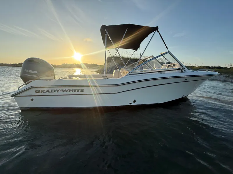 Slide: The Image of 2020 Grady-White Freedom 192 boat on water at sunset with Yamaha engine. - 33
