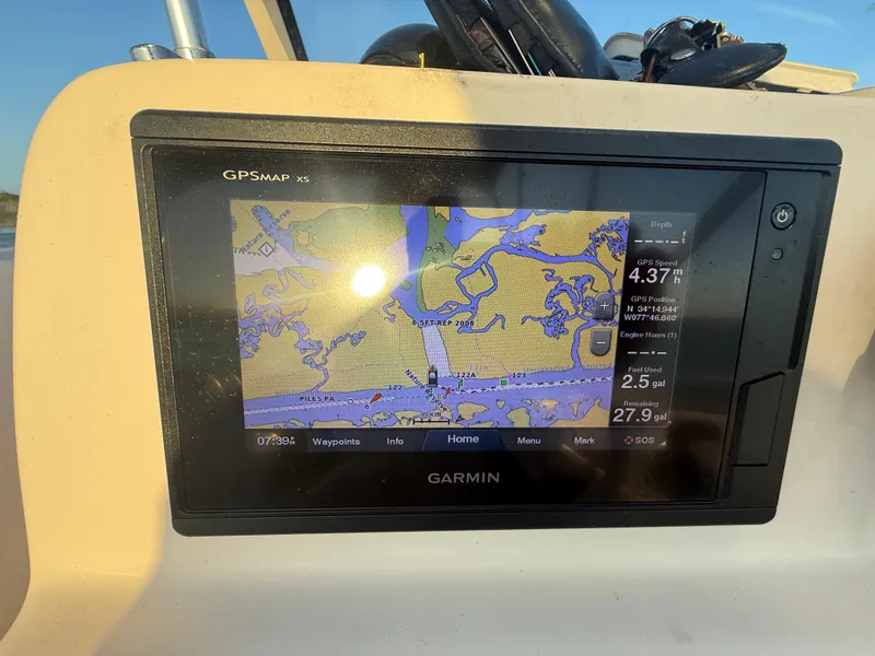 Slide: The Image of Garmin GPS display on 2020 Grady-White Freedom 192 boat, showing navigation map and data. - 34
