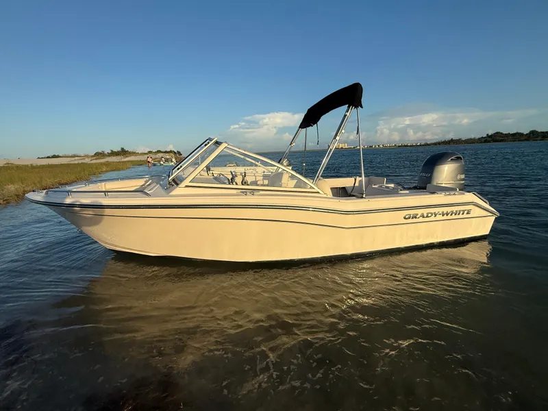 Slide: The Image of 2020 Grady-White Freedom 192 boat on calm water, sunny day, side view. - 36