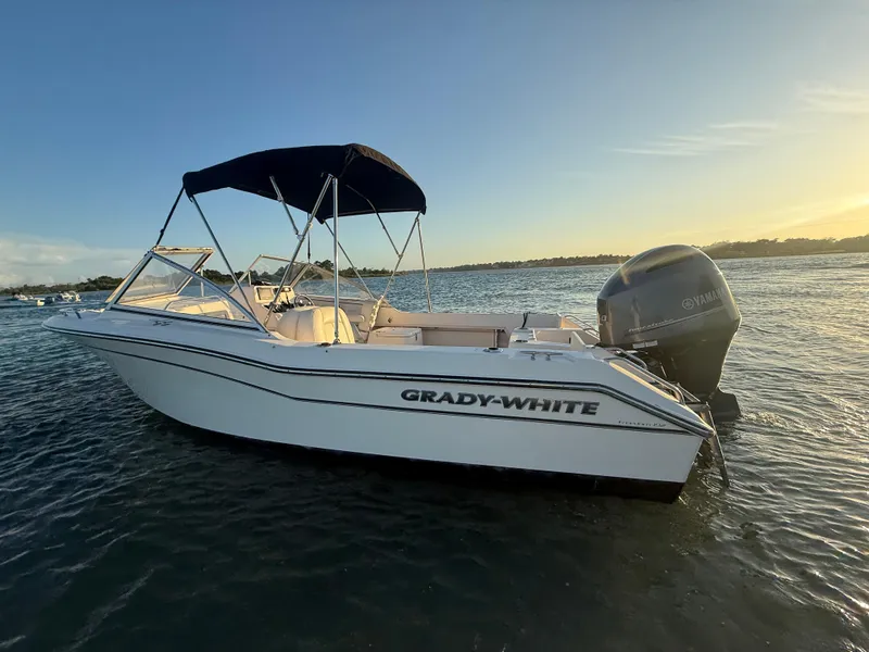 Slide: The Image of 2020 Grady-White Freedom 192 boat on water at sunset with Yamaha engine. - 5