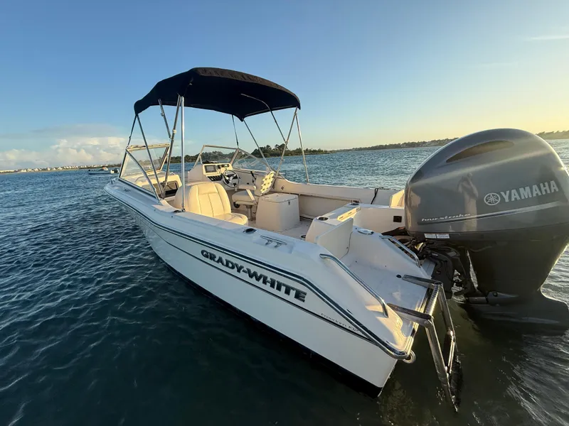 Slide: The Image of 2020 Grady-White Freedom 192 boat with Yamaha engine on calm water at sunset. - 8