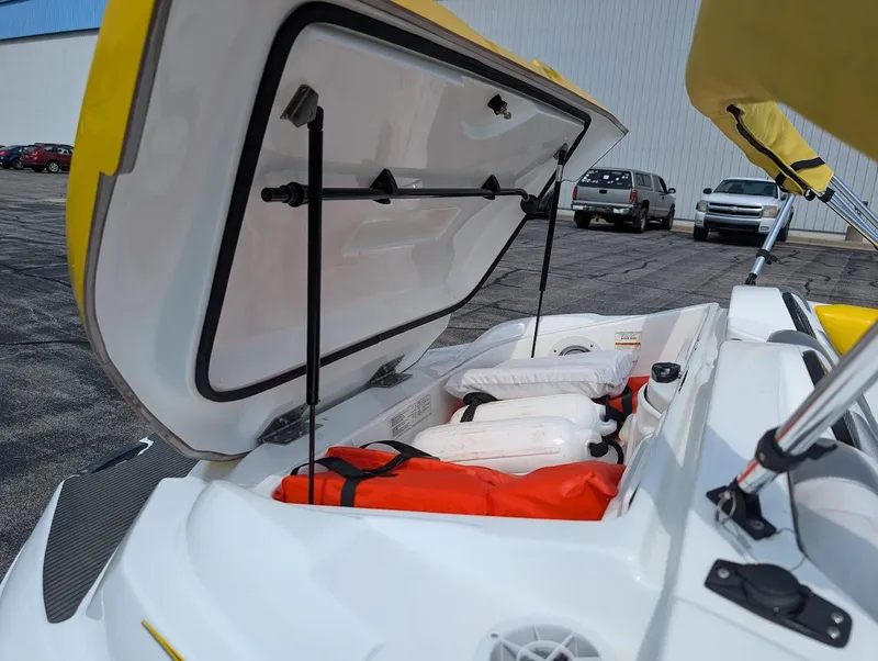 Slide: The Image of Open storage compartment of 2006 Sea-Doo 150 Sportster with safety gear inside. - 13