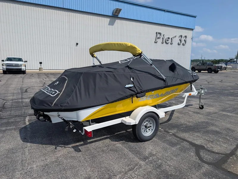 Slide: The Image of 2006 Sea-Doo 150 Sportster with cover on trailer at Pier 33. - 16