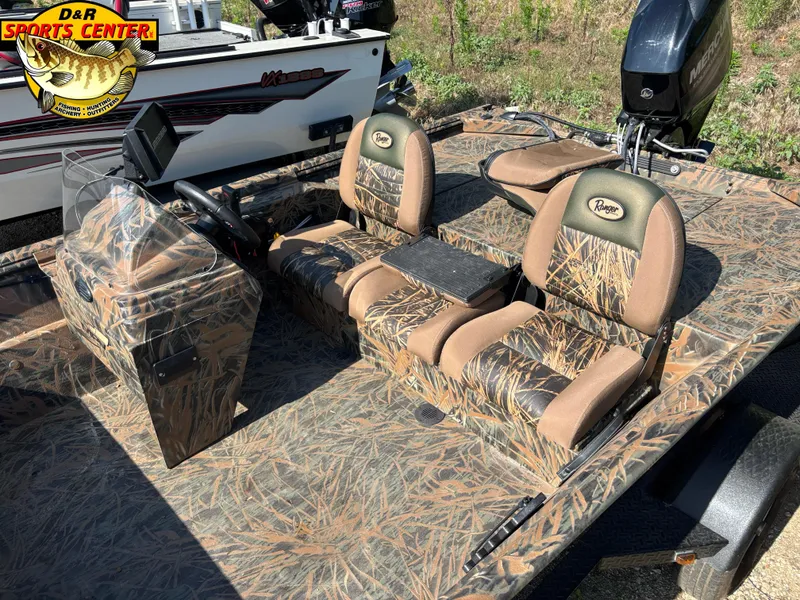 Slide: The Image of 2016 Ranger 1760 MPV boat with camo seats and console, displayed outdoors. - 5