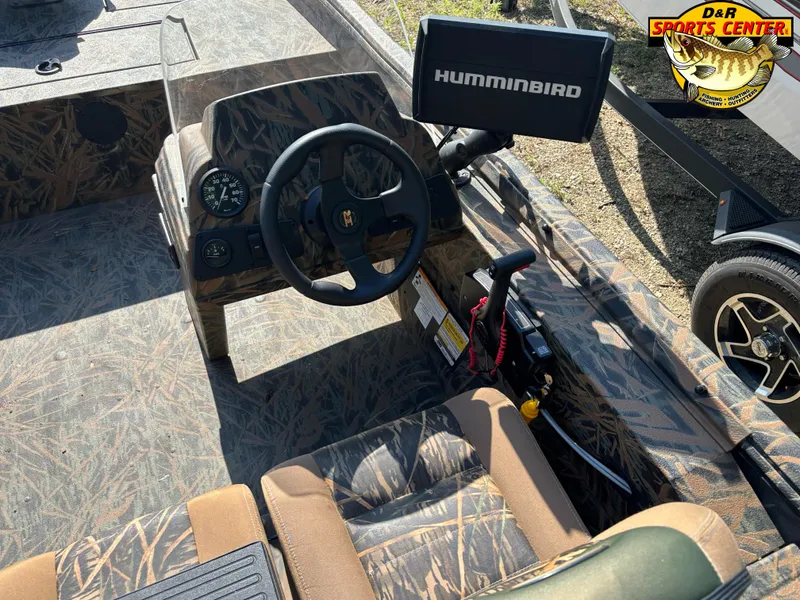 Slide: The Image of 2016 Ranger 1760 MPV boat interior with Humminbird system and camouflage design. - 9