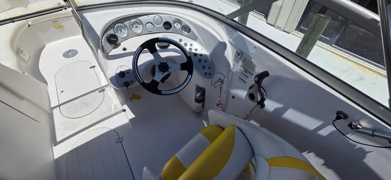 Slide: The Image of Cockpit of 2008 Starcraft 2210 OB Limited boat with steering wheel and gauges. - 11