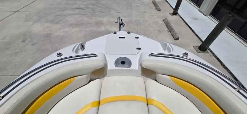 Slide: The Image of 2008 Starcraft 2210 OB Limited boat interior with white and yellow seating. - 13